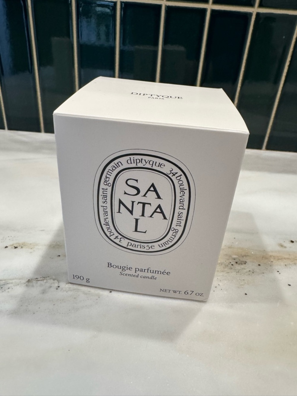 diptyque Santal Candle in White Packaging with Black Logo
